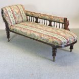 A Victorian walnut and floral upholstered chaise lounge,