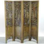 A Japanese hardwood carved four fold screen,