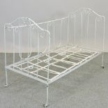 An antique white painted metal cot,