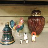 A Beswick pottery cockerel, 24cm high, together with four graduated Beswick penguins,