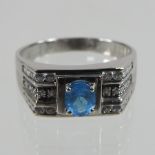 A 14 carat white gold blue topaz and diamond ring,