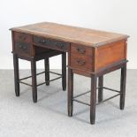 An Edwardian walnut desk,