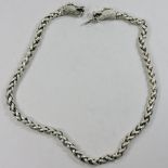 A Chinese style white metal chain, the clasp in the form of dragon heads,