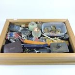 A collection of items to include an onyx table lighter, glass match strikers, coins,
