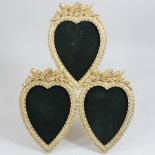 A gilt photograph frame, in the form of three hearts,