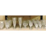 A shelf of cut glass and other drinking glasses,