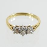 An 18 carat gold old cut three stone diamond ring