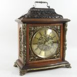 A 20th century mahogany and brass mounted mantel clock,
