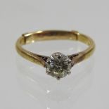 An 18 carat gold solitaire diamond ring, approximately 0.