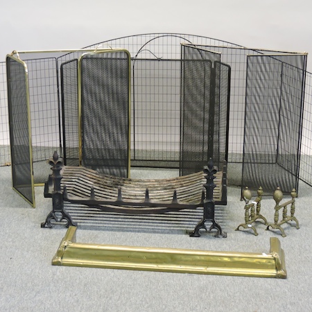 A cast iron fire grate, together with a brass fender, a pair of fire dogs, another pair,