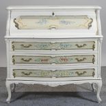 A French style white painted bureau, with floral decoration,