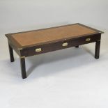 A mahogany brass mounted coffee table, with a leather inset top,