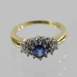 An 18 carat gold sapphire and diamond dress ring,