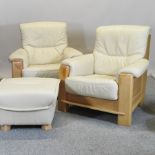 A pair of modern cream upholstered leather armchairs,