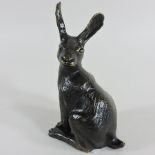A bronze sculpture of a hare,
