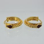 A pair of unmarked ladies hoop earrings,