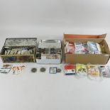 A collection of coins and cigarette cards