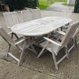 An extending teak garden table, 242 x 100cm overall,