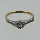 An 18 carat gold, platinum and diamond single stone ring, approximately 0.