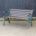 A cast iron and wooden slatted garden bench,