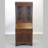 A 1920's oak bureau bookcase,