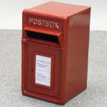 A red painted postbox,