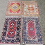 A Persian rug, with a central medallion, on a red field, 190 x 120cm, together with another similar,