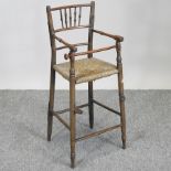 A 19th century elm rush seated child's high chair