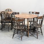 A circular dining table on turned legs, 87cm,