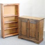 A pine standing open bookcase, together with a side cabinet,