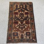 A Turkish prayer rug, with all over designs on a cream field,