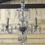 A cut glass three branch chandelier,