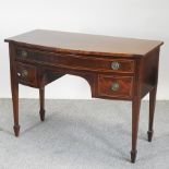 An Edwardian mahogany and satinwood banded bow front sideboard, containing three drawers,