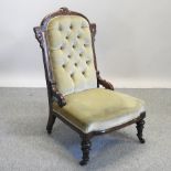 A Victorian oak and green upholstered nursing chair