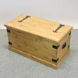 A handmade pine trunk, with a hinged lid,