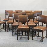 A near set of thirteen oak and upholstered dining chairs,