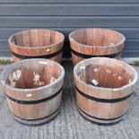 Two pairs of coopered wooden garden planters,