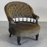 A Victorian green upholstered tub shaped armchair,