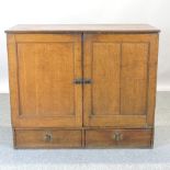 A 19th century oak cupboard,