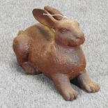 A rusted cast iron model of a hare,