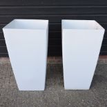 A pair of white square garden pots,