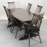 An Ercol dark elm rectangular dining table, 182 x 80cm,