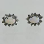 A pair of silver opal and gem set stud earrings,