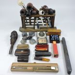 A collection of pipes, cheroot holders, silver and smoking related items,