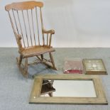 A rocking chair, together with two display cases and a rustic pine framed wall mirror,