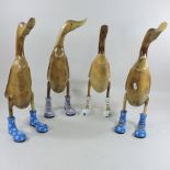 A set of four wooden models of ducks,