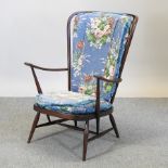 An Ercol dark elm spindle back armchair