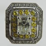 A 14 carat white gold diamond and yellow sapphire cluster ring,