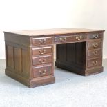 A Victorian mahogany partners desk with a leather inset top,