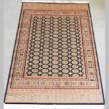 A Bokhara style carpet on a blue ground,